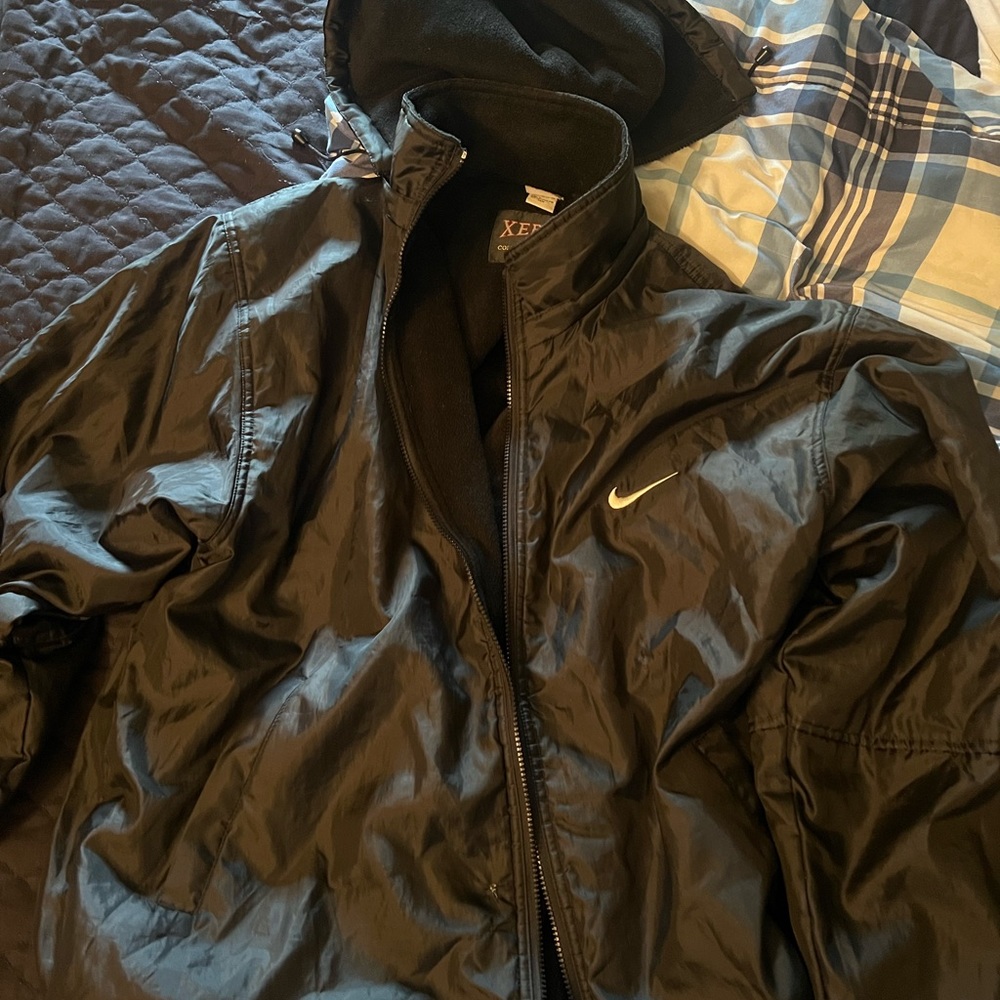 Black Nike jacket great shape just 2 little holes but not noticeable